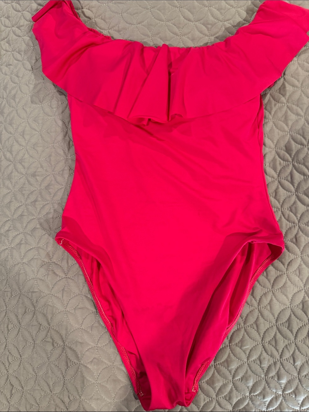 One-Piece soft stretchy swimsuit with ruffle accent. Off or on the shoulder.